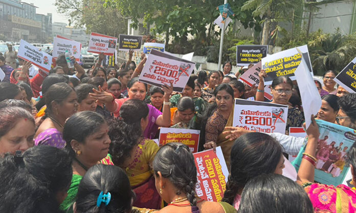Kalvakuntla Kavitha leading Telangana Jagruthi activists during a protest at Praja Bhavan demanding implementation of election promises