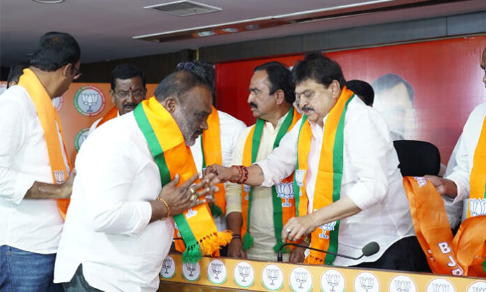 Ramchander Rao welcoming new members at BJP state office in Telangana