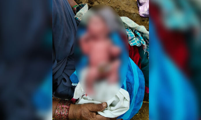 Villagers and Anganwadi teacher rescuing an abandoned newborn baby in Badriya Thanda of Chilipched mandal