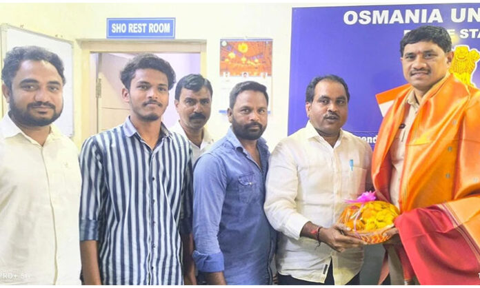 OU JAC Chairman Kothapalli Tirupati felicitating new OU CI Mahesh Goud at Osmania University Police Station
