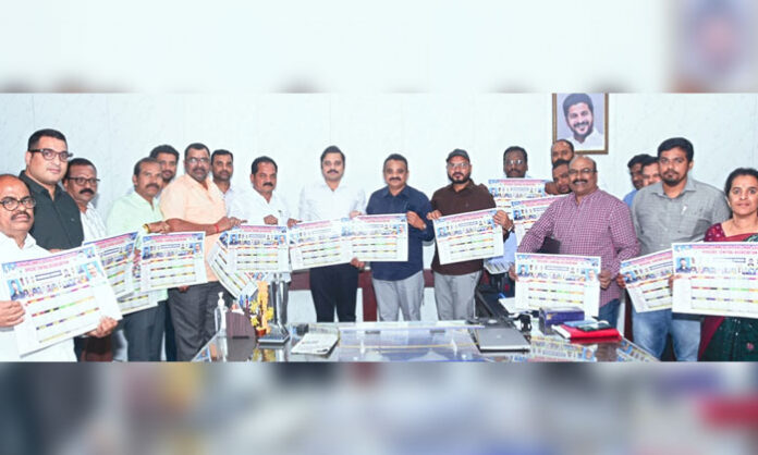 Joint Commissioner P. Nayanar unveiling wall poster of Telangana Commercial Taxes Non-Gazetted Officers Association in Saroor Nagar