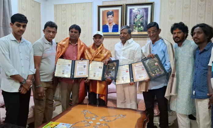 Teegulla Padmarao Goud felicitating honorary doctorate recipients at a ceremony organized with Mahatma Gandhi Global Peace Foundation