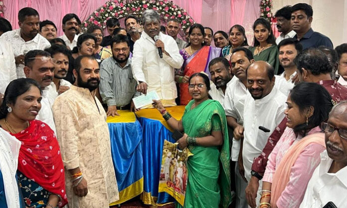 Secunderabad MLA Padmarao Goud distributing Kalyana Lakshmi and Shaadi Mubarak cheques to beneficiaries at Madhuranagar Community Hall
