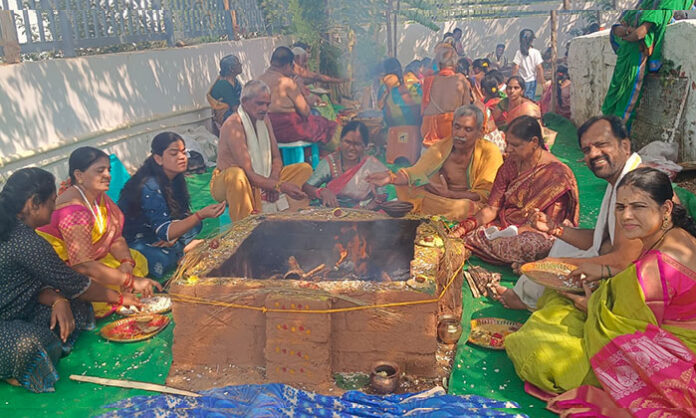 Devotees participate in Rudra Chandi Homam at the newly built Pochamma Muthyalamma Temple in Athvelly Medchal, followed by a food distribution program