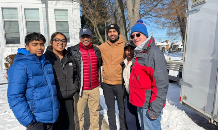 TANA New Jersey volunteers sorting and packing food items at Hands of Hope center in Edison