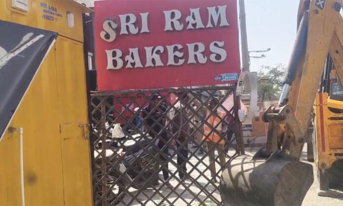 Traffic police and GHMC officials removing boards and sheds to prevent traffic problems during Keesaragutta Brahmotsavams
