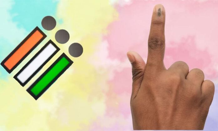 Voters standing in a queue outside a polling booth after casting their votes in an election