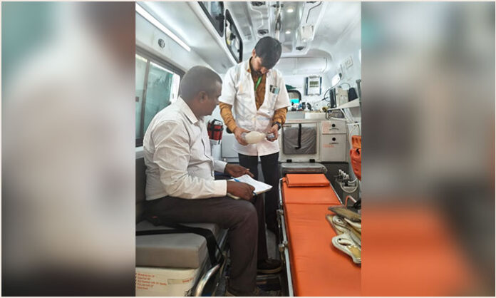 State Audit Officer Venkateshwarlu inspecting 108 ambulance equipment at Nalgonda Government Hospital.