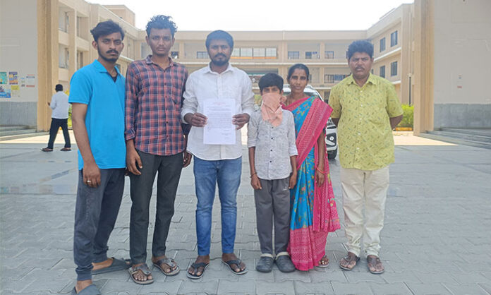 ABVP members submit a memorandum to Nirmal District Additional Collector Kishore Kumar demanding strict punishment for students who attacked a 7th-grade student at Mahatma Jyotiba Phule Gurukula School, citing negligence by school management.