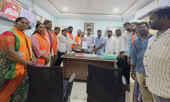 BJP leaders submitting a memorandum to the Kapra Tahsildar protesting non-implementation of six guarantees announced by the Telangana government