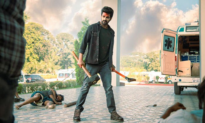 Poster of Bad Boy Karthik showing Naga Shaurya with a raised fist and weapon, fiery background, and a multi-armed goddess idol behind him, highlighting the action-packed and mass entertainer vibe of the movie.