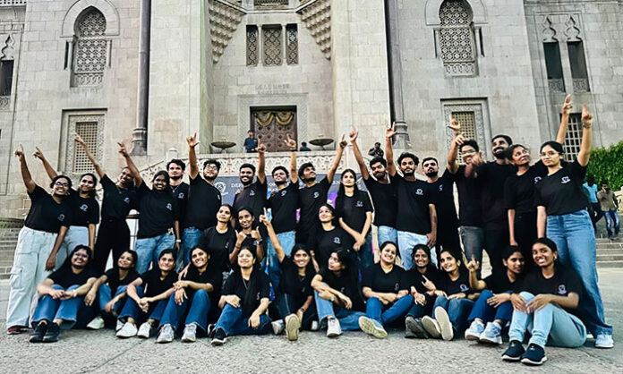 Students performing flashmob dance at Osmania University Arts College to promote Blitzkrieg 2K26 management fest.