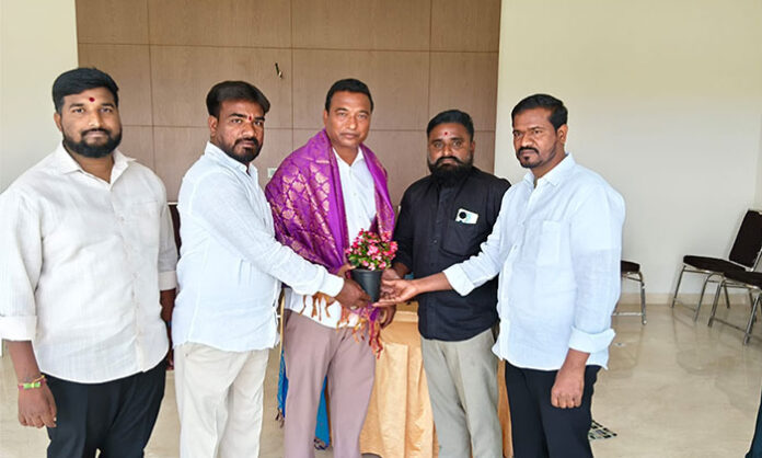 Former Councilor Tudum Ganesh honoring Chamakura Mahender Reddy with a shawl and extending birthday wishes in Medchal