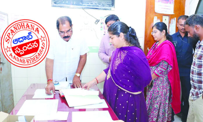 Warangal District Collector Dr. Satya Sarada inspecting Parvathagiri PHC after Aadab Hyderabad reports, reviewing medical services and staff performance.