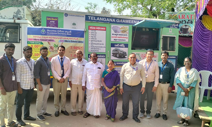 Bank officials conducting cyber crime awareness program with a mobile vehicle in Beervelli village of Sarangapur mandal.