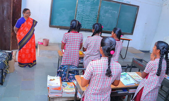 District Collector Hymavathi inspects meal arrangements for students at Zilla Parishad High School in Lakudaram, warning the Headmaster for false information