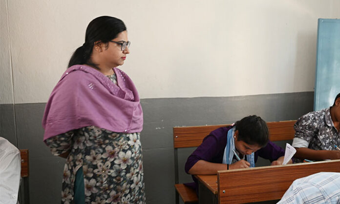 District Collector Abhilasha Abhinav inspects the Government Girls' High School exam center in Somwar Pet to ensure peaceful conduct of 10th-grade examinations