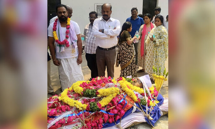 Suraksha Seva Sangham members attending the final rites of Santosh Kumar, honoring his contributions to social service in Telangana