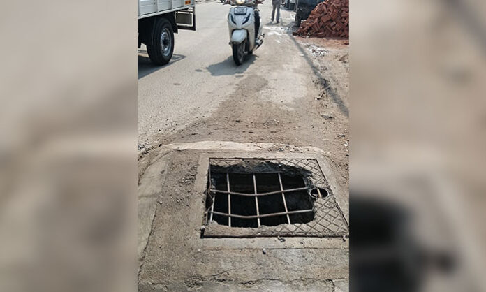 SC Cell President Kunda Bhanuchander highlights a dangerous broken manhole on Ward Office to Apparel Park route in Gundla Pochampally, Hyderabad