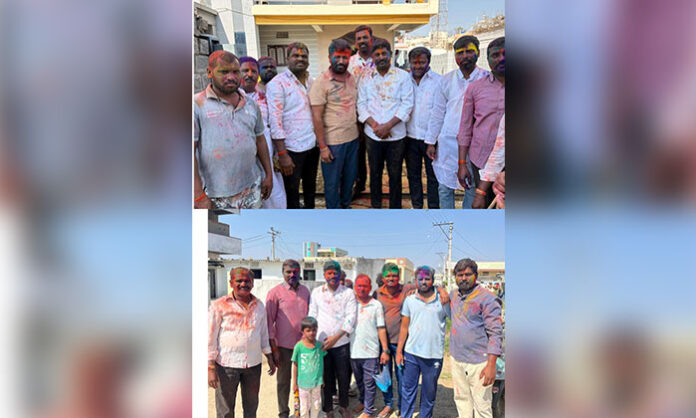 Holi celebrations in Nandigama Mandal with villagers, youth, and public representatives including Shivshankar Goud, Mankala Srisailam, and Avulamanda Shivshankar