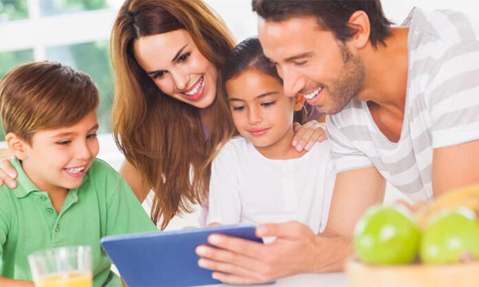 Parents spending quality time with their child instead of mobile phone highlighting importance of parent child connection in digital age