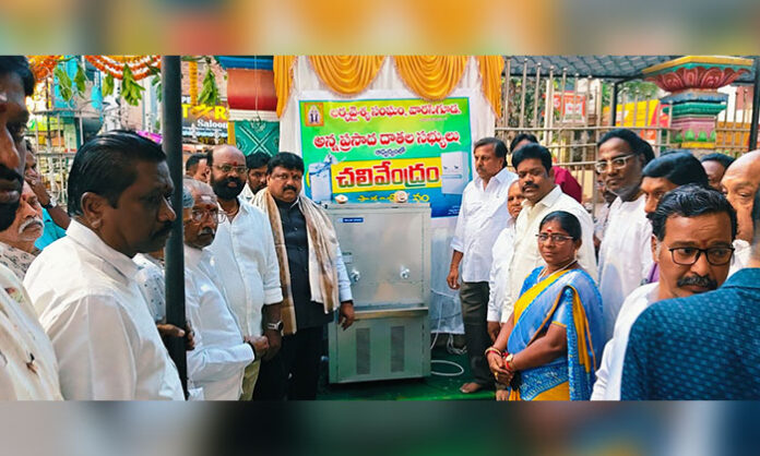 Devotees attending Panchanga Sravanam and Ugadi Pachadi distribution at Namalagundu Veeranjaneya Swamy Temple with Temple Chairman Kacham Ramu and Warasiguda Arya Vysya Association leaders