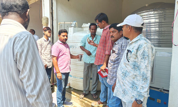 Sanitary Inspector Praveen inspects water plants in Nirmal, identifying unhygienic conditions and imposing fines for safety violations