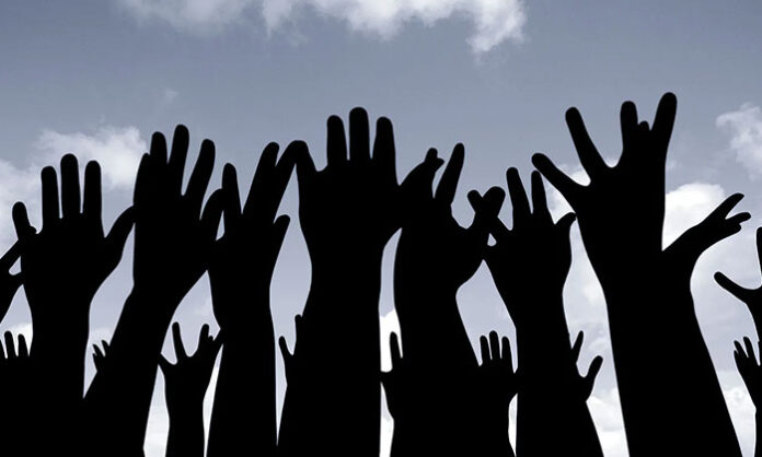 Conceptual image representing citizens demanding accountability and justice from political leaders in a democracy