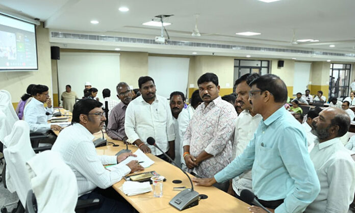 Additional Collector Venkateshwarlu addressing officials during the Prajavani program, emphasizing timely resolution of public applications.