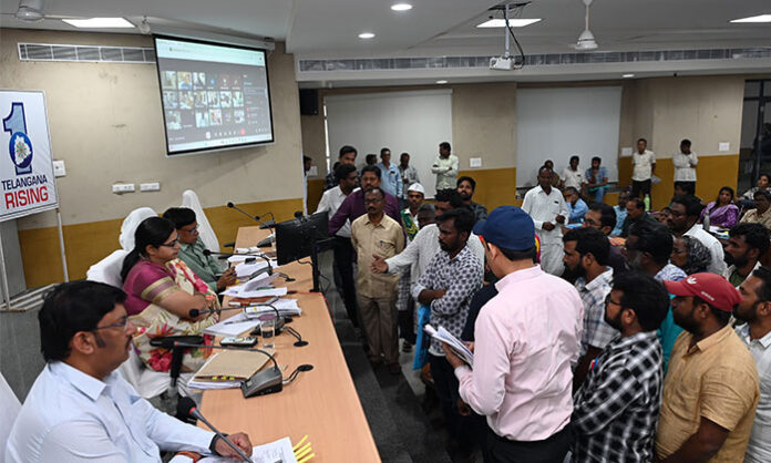 District Collector Abhilasha Abhinav receiving and resolving Prajavani applications from citizens at the Collectorate program.