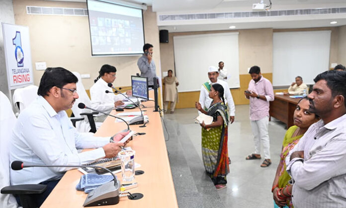 Additional Collector Venkateshwarlu receiving applications from the public during a public hearing program at the Collectorate.
