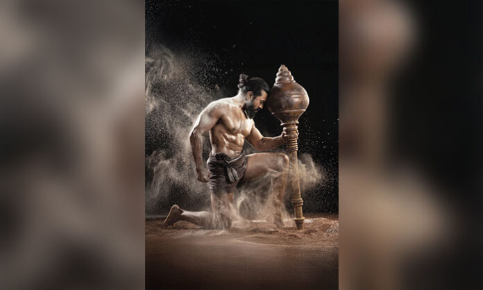 Ram Charan in Peddi Pehelwan glimpse showcasing his muscular wrestler transformation with intense training visuals and Hanuman-inspired pose