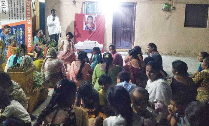 Leaders paying floral tributes to Savitribai Phule portrait during her death anniversary program in Warangal Kothawada.