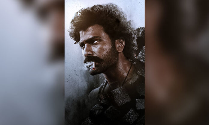 Sharwanand appearing in a rugged mass look in the birthday special poster of the film Bhogi