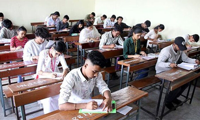 Telangana 10th class students writing SSC public examinations using OMR answer sheet system