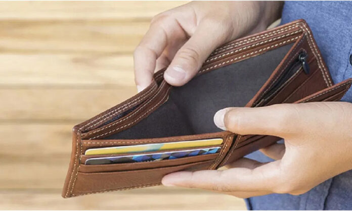 Vastu tips for purse suggesting peacock feather rice grains and turmeric for wealth and Lakshmi blessings