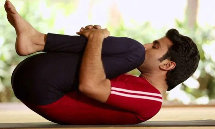 Yoga postures like Pavanmuktasana and Bhujangasana help improve digestion, reduce bloating, and boost metabolism naturally.