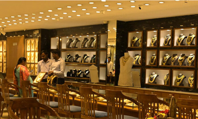 Customers buying gold jewellery in crowded stores during Akshaya Tritiya festival in India with record sales