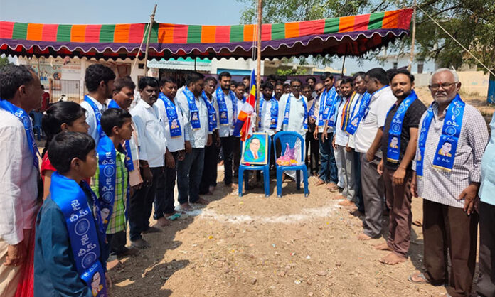 Residents of Sofinagar Colony celebrating Ambedkar Jayanti by garlanding portrait and participating in community program