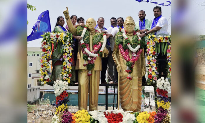 Sarpanch Vijaya Srisailam Goud paying tribute to Dr BR Ambedkar during Jayanti celebrations in Abdullapurmet