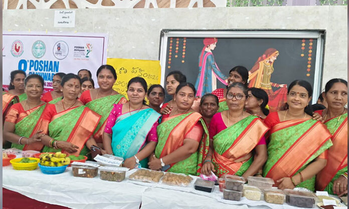 District Collector Rahul Sharma distributing smartphones to Anganwadi workers in Jayashankar Bhupalpally to improve service transparency.