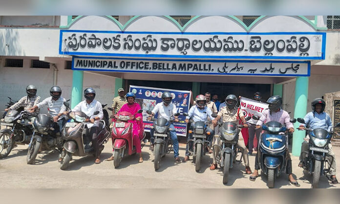 Bellampalli road safety awareness program Arrive Alive 2026 with municipal chairperson and commissioner addressing public