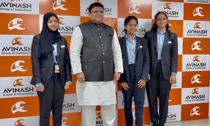 Avinash College students celebrating top ranks in state IPE results with certificates and awards