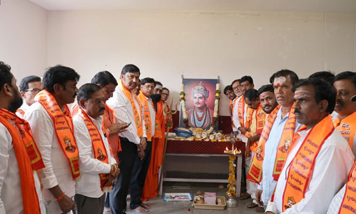 Officials paying floral tribute to Basaveshwara Maharaj portrait during Jayanti celebrations at district collectorate