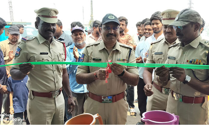 Police-run free drinking water center (Chalivendram) set up on Bellampalli flyover providing water to commuters during intense summer heat.