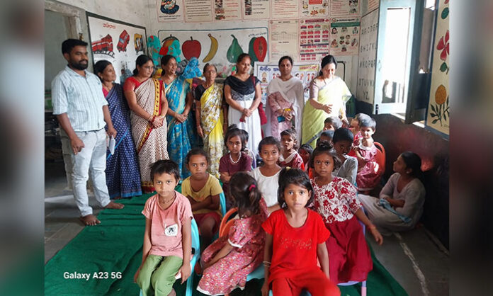 Child Rights Commission member Pramila Agarwal inspecting Anganwadi center and interacting with children during district visit to ensure proper care and nutrition.