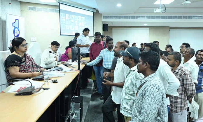 District Collector Abhilasha Abhinav addressing Prajavani program and reviewing public grievance applications for quick resolution