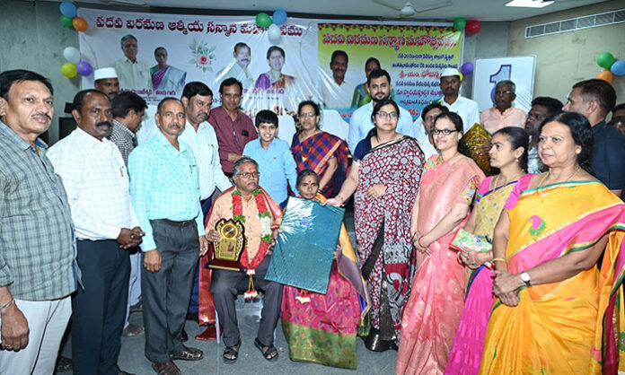 District Collector Abhilasha Abhinav felicitating retiring officials Rajeswar and Bhojanna at the Collectorate ceremony.