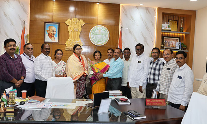 District Collector Abhilasha Abhinav being congratulated by officials for receiving SKOCH Awards at the Collectorate.
