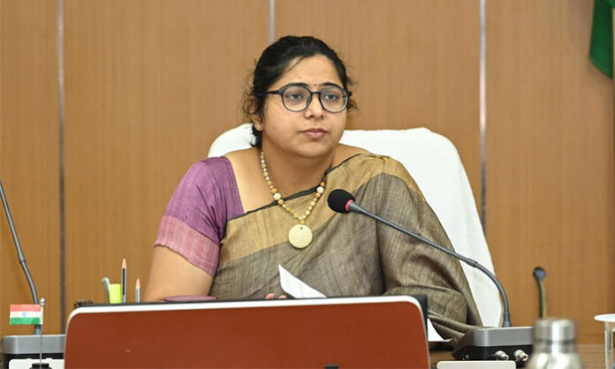District Collector Abhilasha Abhinav reviewing healthcare services and instructing officials in a government hospital meeting
